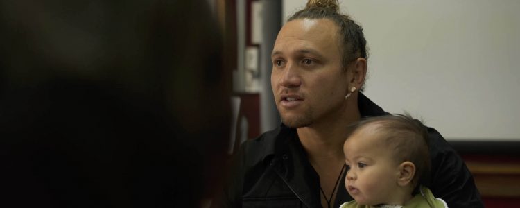 Man from Taranaki with child discussing Taranaki Mounga project